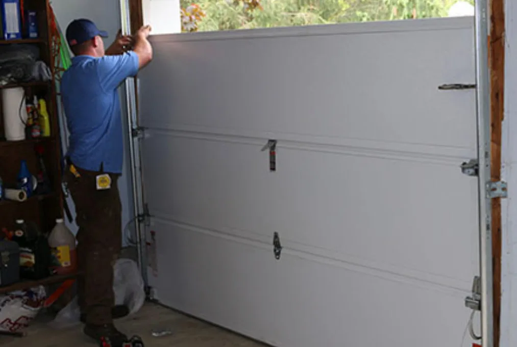 Man providing garage door repair
