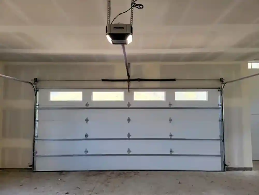 Garage door opener connected to a garage door