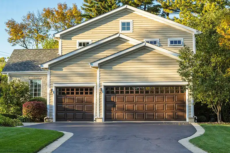 Garage door with replaceable panels